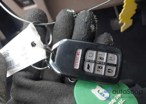 2018 Honda Odyssey Touring z USA, uszkodzony, nr VIN 5FNRL6H85JB017522